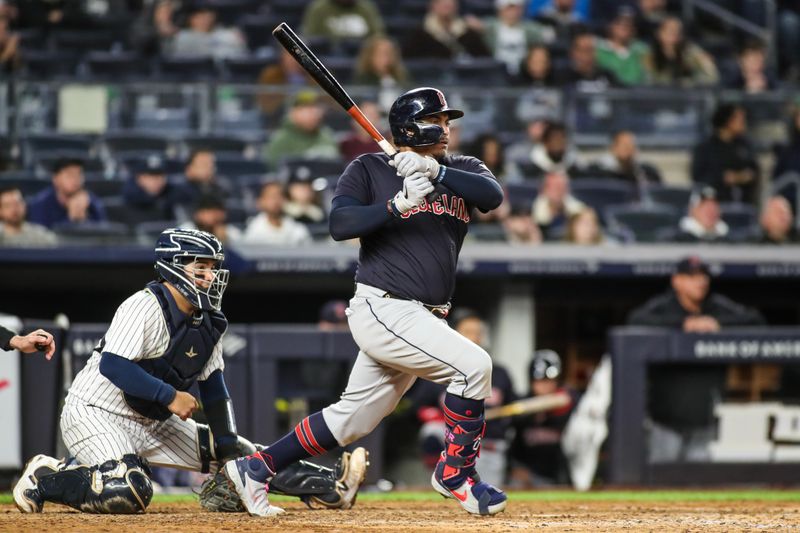 May 1, 2023; Bronx, New York, USA;  Cleveland Guardians first baseman Josh Naylor (22) hits a two run single in the ninth inning against the New York Yankees at Yankee Stadium. Mandatory Credit: Wendell Cruz-USA TODAY Sports