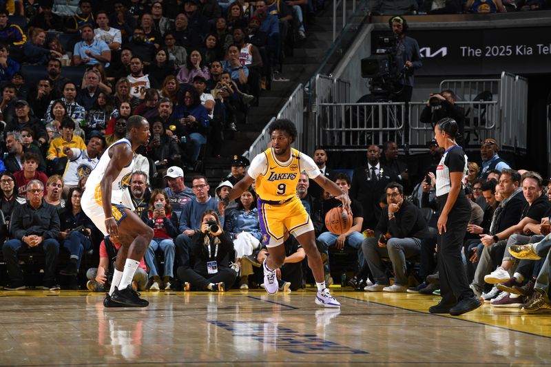 SAN FRANCISCO, CA - OCTOBER 18: Bronny James #9 of the Los Angeles Lakers handles the ball during the game against the Golden State Warriors during a NBA Preseason game on October 18, 2024 at Chase Center in San Francisco, California. NOTE TO USER: User expressly acknowledges and agrees that, by downloading and or using this photograph, user is consenting to the terms and conditions of Getty Images License Agreement. Mandatory Copyright Notice: Copyright 2024 NBAE (Photo by Noah Graham/NBAE via Getty Images)