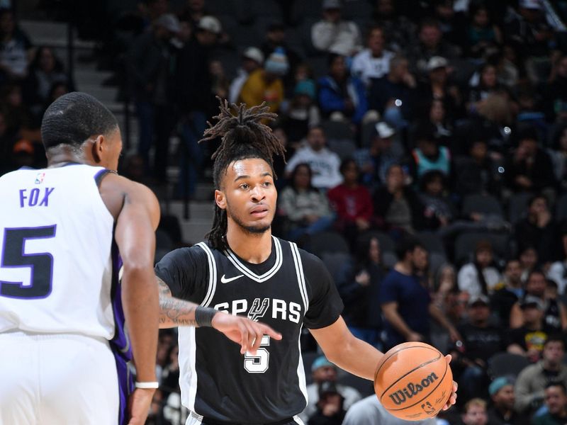 SAN ANTONIO, TX - DECEMBER 6: Stephon Castle #5 of the San Antonio Spurs handles the ball during the game against the Sacramento Kings on December 6, 2024 at the Frost Bank Center in San Antonio, Texas. NOTE TO USER: User expressly acknowledges and agrees that, by downloading and or using this photograph, user is consenting to the terms and conditions of the Getty Images License Agreement. Mandatory Copyright Notice: Copyright 2024 NBAE (Photos by Michael Gonzales/NBAE via Getty Images)