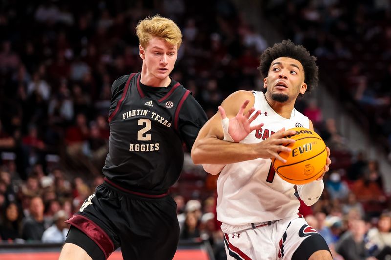 Jan 14, 2023; Columbia, South Carolina, USA; South Carolina Gamecocks guard Jacobi Wright (1) drives around Texas A&M Aggies guard Khalen Robinson (1) in the first half at Colonial Life Arena. Mandatory Credit: Jeff Blake-USA TODAY Sports