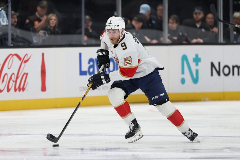 Dec 10, 2025; Salt Lake City, Utah, USA; Florida Panthers center Sam Bennett (9) advances the puck against the Utah Mammoth during the first period at Delta Center. Mandatory Credit: Rob Gray-Imagn Images