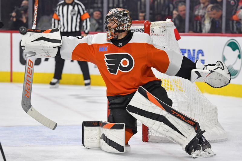 Jan 10, 2024; Philadelphia, Pennsylvania, USA; Philadelphia Flyers goaltender Samuel Ersson (33) makes a save against the Montreal Canadiens during the second period at Wells Fargo Center. Mandatory Credit: Eric Hartline-USA TODAY Sports