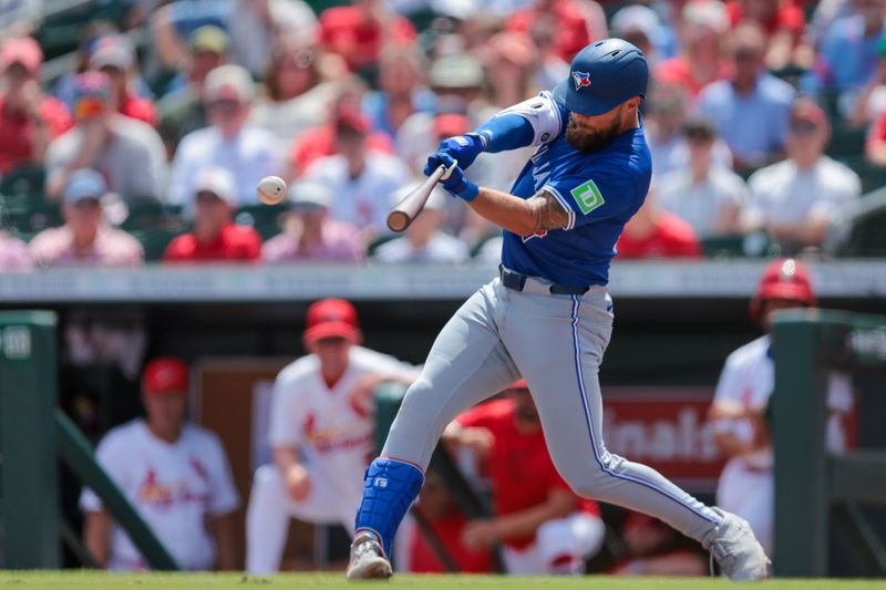 Mar 15, 2025; Jupiter, Florida, USA; Toronto Blue Jays designated hitter Nathan Lukes (38) hits an RBI single against the St. Louis Cardinals during the second inning at Roger Dean Chevrolet Stadium. Mandatory Credit: Sam Navarro-Imagn Images