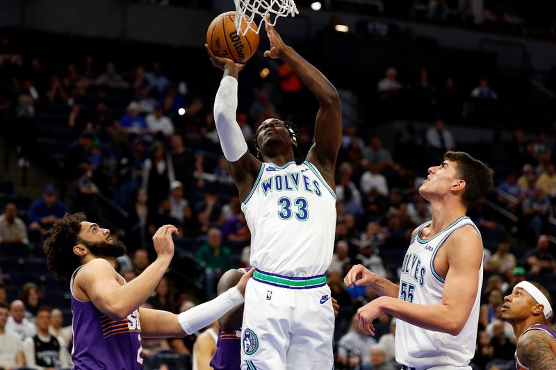 MINNEAPOLIS, MINNESOTA - APRIL 14: Leonard Miller #33 of the Minnesota Timberwolves goes up for a shot against the Phoenix Suns in the fourth quarter at Target Center on April 14, 2024 in Minneapolis, Minnesota. The Suns defeated the Timberwolves 125-106. NOTE TO USER: User expressly acknowledges and agrees that, by downloading and or using this photograph, User is consenting to the terms and conditions of the Getty Images License Agreement. (Photo by David Berding/Getty Images)