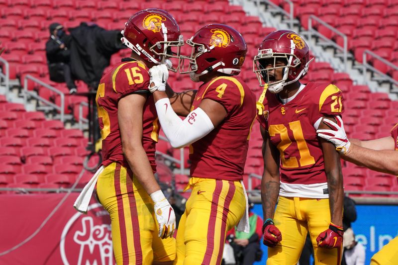 Nov 7, 2020; Los Angeles CA, USA; Southern California Trojans wide receiver Drake London (15) celebrates with wide receiver Tyler Vaughns (21) and wide receiver Bru McCoy (4) after catching a 21-yard touchdown pass with 1:20 to play for the winning score against the Arizona State Sun Devils at the Los Angeles Memorial Coliseum. USC defeated Arizona State 28-27.  Mandatory Credit: Kirby Lee-USA TODAY Sports