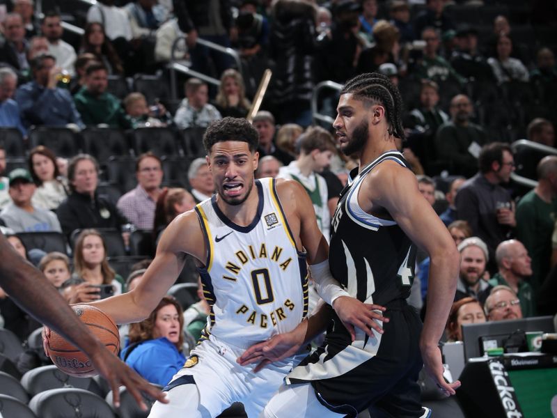 MILWAUKEE, WI - NOVEMBER 22:  Tyrese Haliburton #0 of the Indiana Pacers dribbles the ball during the game against the Milwaukee Bucks during a Emirates NBA Cup on November 22, 2024 at Fiserv Forum Center in Milwaukee, Wisconsin. NOTE TO USER: User expressly acknowledges and agrees that, by downloading and or using this Photograph, user is consenting to the terms and conditions of the Getty Images License Agreement. Mandatory Copyright Notice: Copyright 2024 NBAE (Photo by Gary Dineen/NBAE via Getty Images).