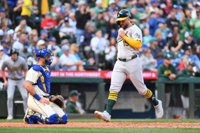 Sep 29, 2024; Seattle, Washington, USA; Oakland Athletics right fielder Seth Brown (15) scores a run against the Seattle Mariners during the seventh inning at T-Mobile Park. Mandatory Credit: Steven Bisig-Imagn Images