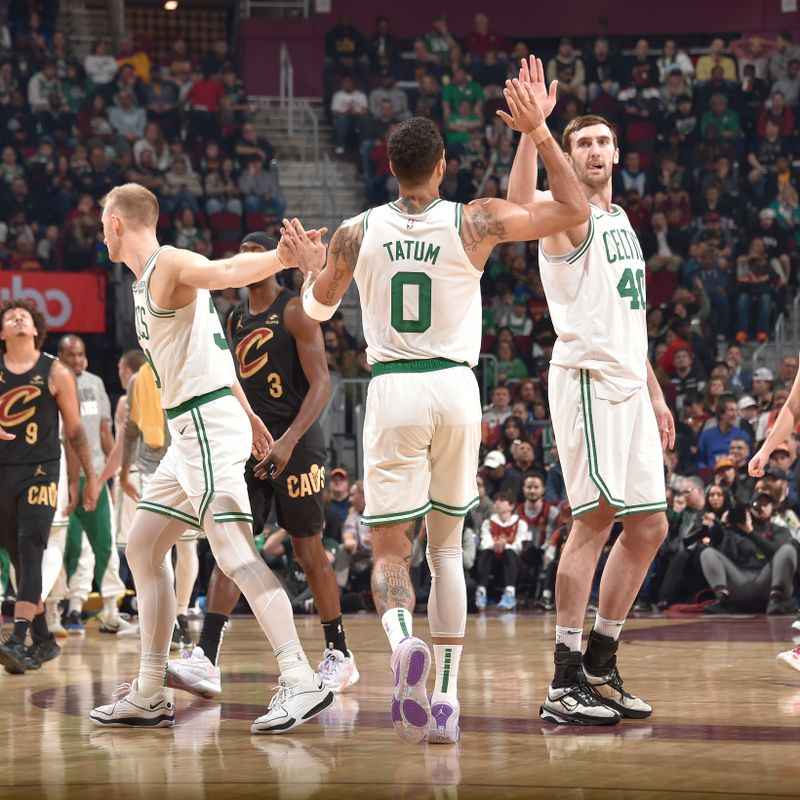 CLEVELAND, OH - MARCH 5: Sam Hauser #30, Jayson Tatum #0, and Luke Kornet #40 of the Boston Celtics high five during the game against the Cleveland Cavaliers on March 5, 2024 at Rocket Mortgage FieldHouse in Cleveland, Ohio. NOTE TO USER: User expressly acknowledges and agrees that, by downloading and/or using this Photograph, user is consenting to the terms and conditions of the Getty Images License Agreement. Mandatory Copyright Notice: Copyright 2024 NBAE (Photo by David Liam Kyle/NBAE via Getty Images)