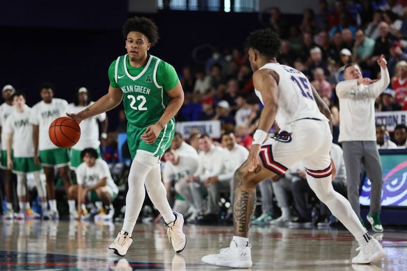 Jan 28, 2024; Boca Raton, Florida, USA; North Texas Mean Green guard CJ Noland (22) dribbles the basketball against Florida Atlantic Owls guard Alijah Martin (15) during the first half at Eleanor R. Baldwin Arena. Mandatory Credit: Sam Navarro-USA TODAY Sports