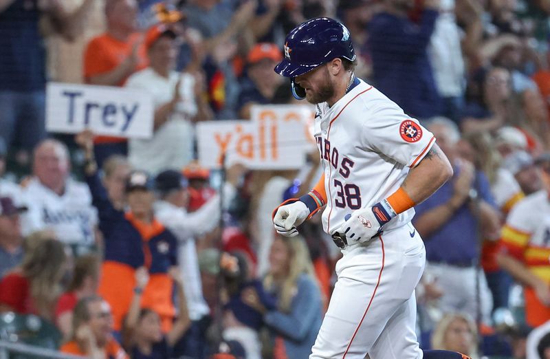 Jun 5, 2024; Houston, Texas, USA; Fans hold signs as Houston Astros right fielder Trey Cabbage (38) rounds the bases after hitting a home run during the fifth inning against the St. Louis Cardinals at Minute Maid Park. Mandatory Credit: Troy Taormina-USA TODAY Sports