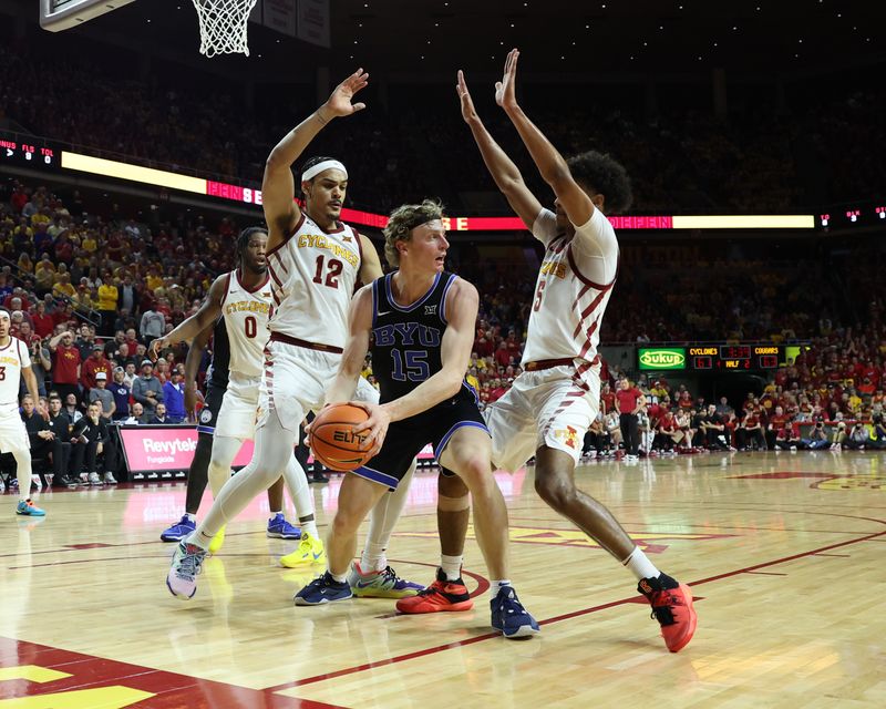 Mar 6, 2024; Ames, Iowa, USA; Brigham Young Cougars guard Richie Saunders (15) is defended by Iowa State Cyclones forward Robert Jones (12) and Iowa State Cyclones guard Curtis Jones (5) in the second half at James H. Hilton Coliseum. Mandatory Credit: Reese Strickland-USA TODAY Sports

