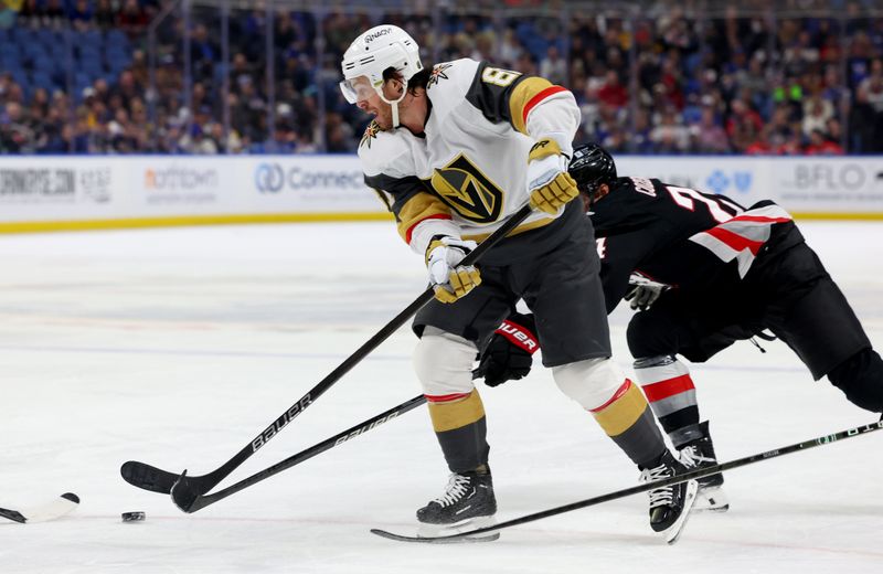 Mar 2, 2024; Buffalo, New York, USA;  Buffalo Sabres center Dylan Cozens (24) knocks the puck off the stick of Vegas Golden Knights right wing Jonathan Marchessault (81) during the first period at KeyBank Center. Mandatory Credit: Timothy T. Ludwig-USA TODAY Sports