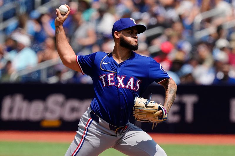 Jul 28, 2024; Toronto, Ontario, CAN; Texas Rangers pitcher Jonathan Hernandez (72) pitches to the Toronto Blue Jays during the first inning at Rogers Centre. Mandatory Credit: John E. Sokolowski-USA TODAY Sports