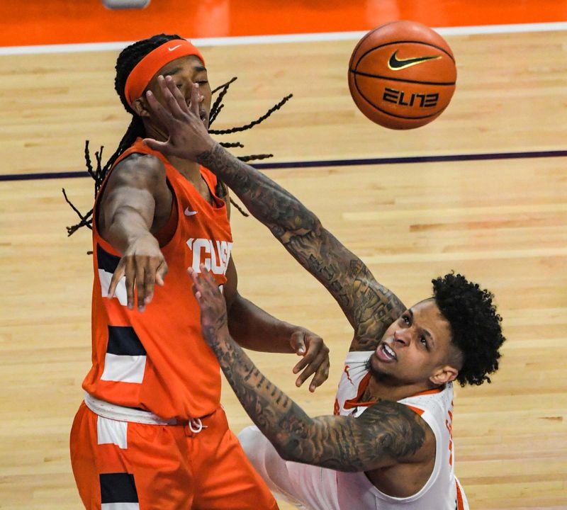 Feb 22, 2023; Clemson, South Carolina, USA; Clemson guard Brevin Galloway (11) shoots against Syracuse forward Maliq Brown (1) during the first half at Littlejohn Coliseum. Mandatory Credit: Ken Ruinard-USA TODAY Sports