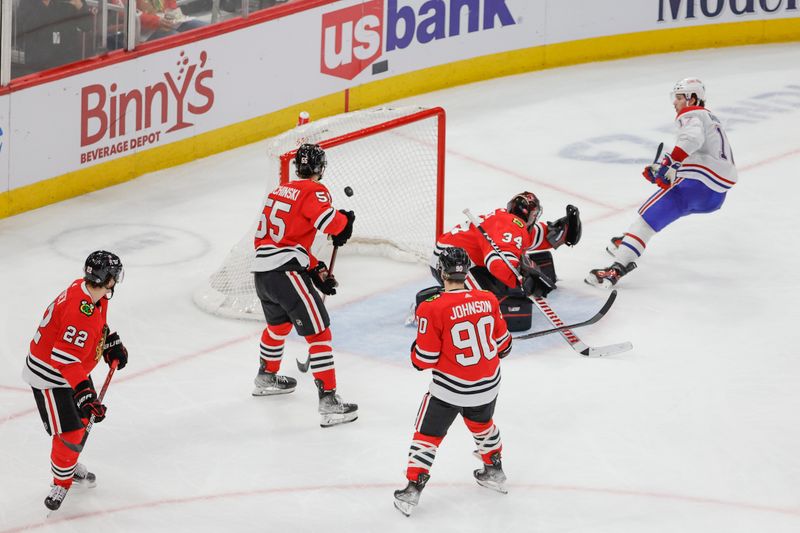 Dec 22, 2023; Chicago, Illinois, USA; Montreal Canadiens right wing Josh Anderson (17) scores a goal against Chicago Blackhawks goaltender Petr Mrazek (34) during the second period at United Center. Mandatory Credit: Kamil Krzaczynski-USA TODAY Sports