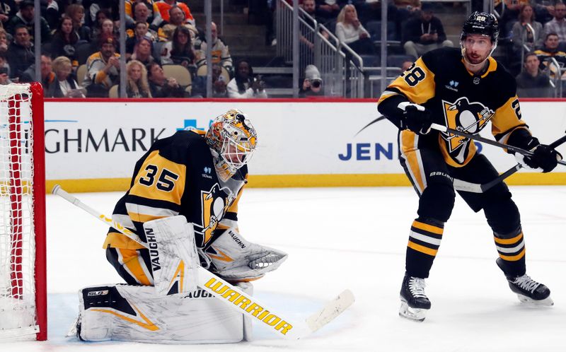 Feb 25, 2024; Pittsburgh, Pennsylvania, USA;  Pittsburgh Penguins goaltender Tristan Jarry (35) makes a save against the Philadelphia Flyers during the first period at PPG Paints Arena. Mandatory Credit: Charles LeClaire-USA TODAY Sports