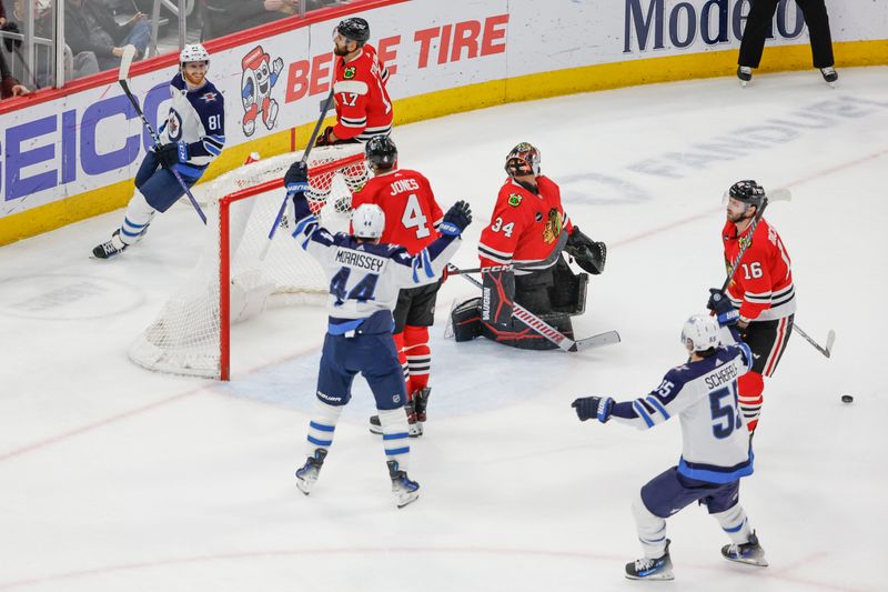 Feb 23, 2024; Chicago, Illinois, USA; Winnipeg Jets left wing Kyle Connor (81) celebrates after scoring a game winning goal against the Chicago Blackhawks during overtime at United Center. Mandatory Credit: Kamil Krzaczynski-USA TODAY Sports