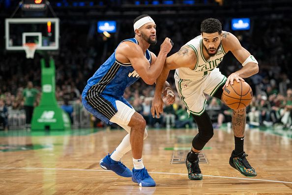 BOSTON, MASSACHUSETTS - DECEMBER 17: Jayson Tatum #0 of the Boston Celtics drives to the basket against Jalen Suggs #4 of the Orlando Magic during the second half at TD Garden on December 17, 2023 in Boston, Massachusetts. NOTE TO USER: User expressly acknowledges and agrees that, by downloading and or using this photograph, user is consenting to the terms and conditions of the Getty Images License Agreement. (Photo by Maddie Malhotra/Getty Images)