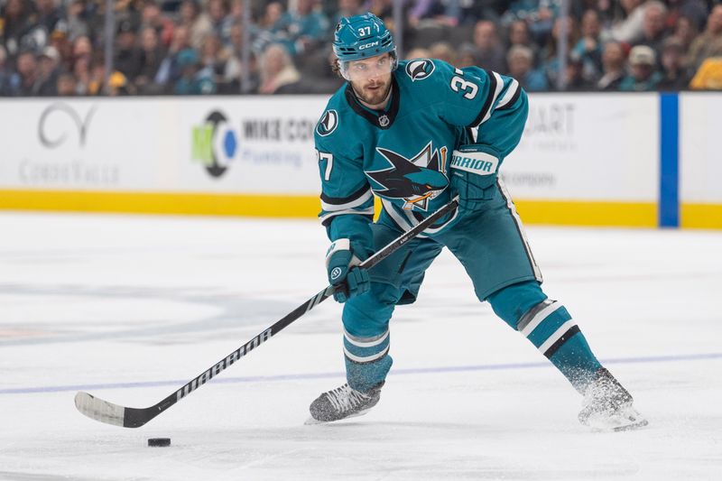 Mar 22, 2025; San Jose, California, USA;  San Jose Sharks defenseman Timothy Liljegren (37) controls the puck during the second period against the Boston Bruins at SAP Center at San Jose. Mandatory Credit: Stan Szeto-Imagn Images