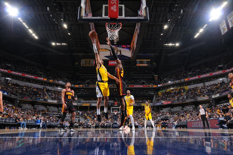 INDIANAPOLIS, IN - APRIL 14: Andrew Nembhard #2 of the Indiana Pacers shoots the ball during the game against the Atlanta Hawks on April 14, 2024 at Gainbridge Fieldhouse in Indianapolis, Indiana. NOTE TO USER: User expressly acknowledges and agrees that, by downloading and or using this Photograph, user is consenting to the terms and conditions of the Getty Images License Agreement. Mandatory Copyright Notice: Copyright 2024 NBAE (Photo by Ron Hoskins/NBAE via Getty Images)