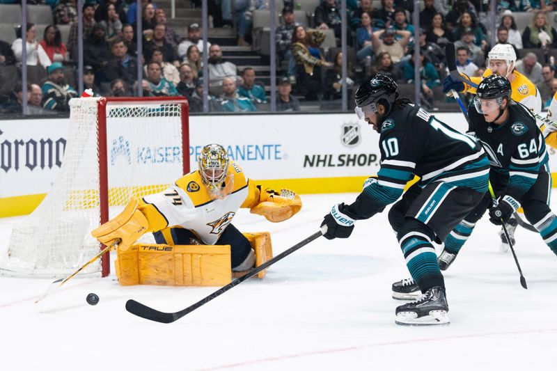 Feb 24, 2024; San Jose, California, USA; Nashville Predators goaltender Juuse Saros (74) defends the goal during the second period against San Jose Sharks left wing Anthony Duclair (10) at SAP Center at San Jose. Mandatory Credit: Stan Szeto-USA TODAY Sports