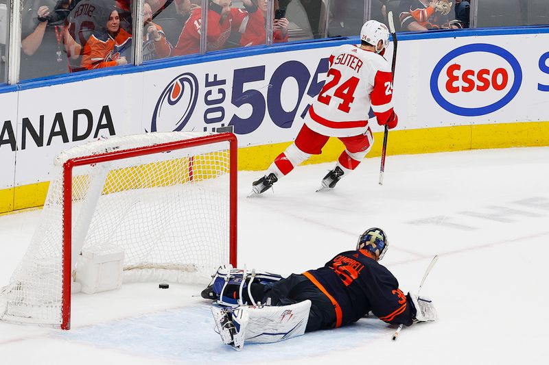 Feb 15, 2023; Edmonton, Alberta, CAN; Detroit Red Wings forward Pius Suter (24) scores the shoot-out winning goal against Edmonton Oilers goaltender Jack Campbell (36) at Rogers Place. Mandatory Credit: Perry Nelson-USA TODAY Sports