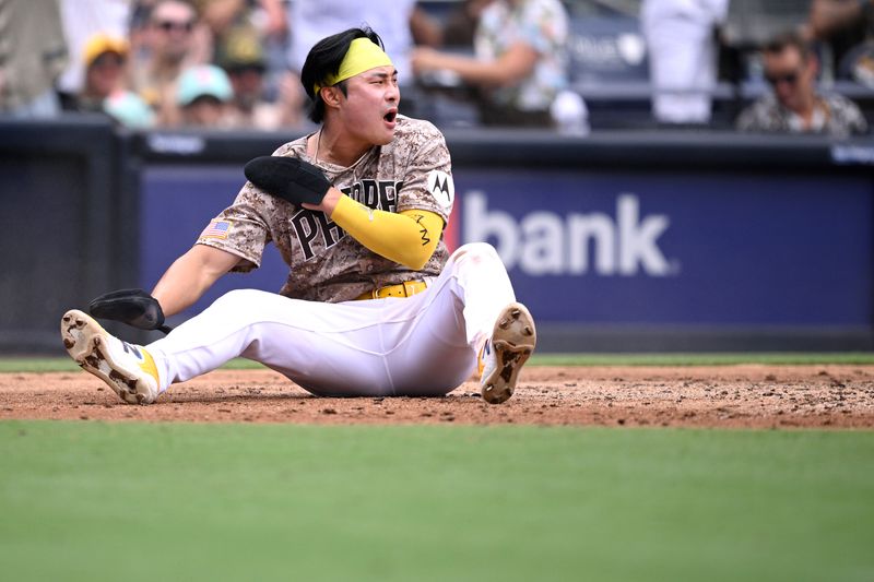 Jul 30, 2023; San Diego, California, USA; San Diego Padres second baseman Ha-seong Kim (7) reacts after scoring a run against the Texas Rangers during the third inning at Petco Park. Mandatory Credit: Orlando Ramirez-USA TODAY Sports