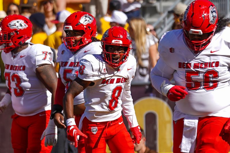 Sep 30, 2023; Laramie, Wyoming, USA; New Mexico Lobos wide receiver Jeremiah Hixon (8) celebrates a touchdown against the Wyoming Cowboys during the first quarter at Jonah Field at War Memorial Stadium. Mandatory Credit: Troy Babbitt-USA TODAY Sports

