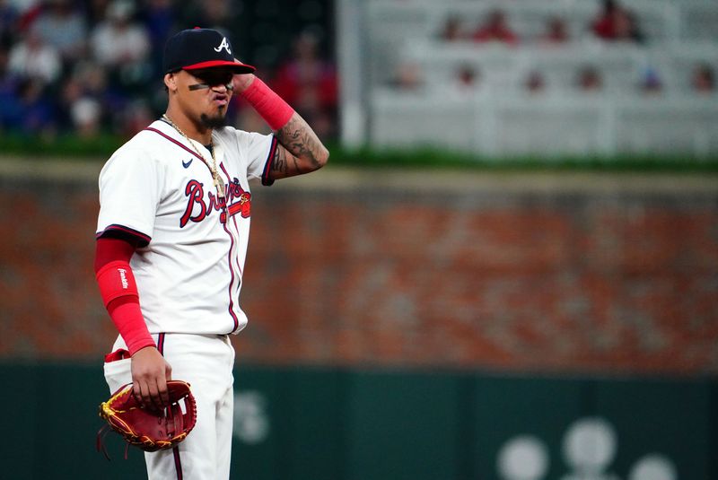 May 13, 2024; Cumberland, Georgia, USA; Atlanta Braves shortstop Orlando Arcia (11) reacts against the Chicago Cubs during the eighth inning at Truist Park. Mandatory Credit: John David Mercer-USA TODAY Sports