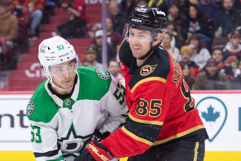 Nov 11, 2025; Ottawa, Ontario, CAN; Dallas Stars center Wyatt Johnston (53) battles with Ottawa Senators defenseman Jake Sanderson (85) in the second period at the Canadian Tire Centre. Mandatory Credit: Marc DesRosiers-IMAGN Images
