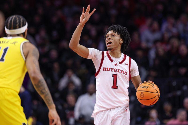 Feb 1, 2025; Piscataway, New Jersey, USA; Rutgers Scarlet Knights guard Jamichael Davis (1) signals during the second half against the Michigan Wolverines at Jersey Mike's Arena. Mandatory Credit: Vincent Carchietta-Imagn Images