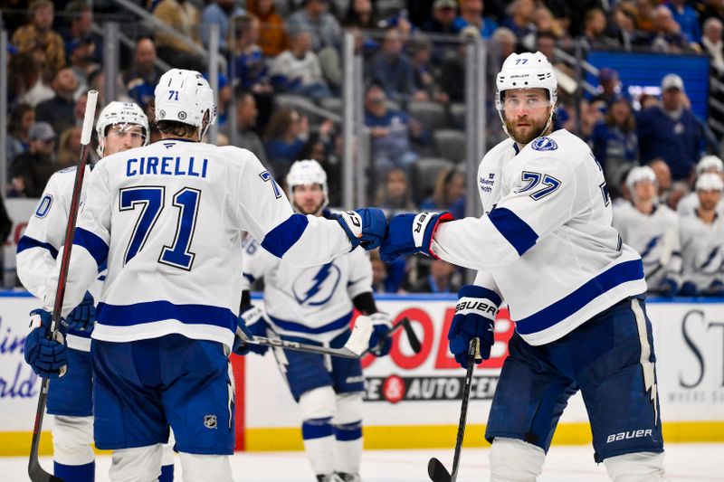 Nov 5, 2024; St. Louis, Missouri, USA;  Tampa Bay Lightning defenseman Victor Hedman (77) is congratulated by center Anthony Cirelli (71) after scoring against the St. Louis Blues during the third period at Enterprise Center. Mandatory Credit: Jeff Curry-Imagn Images