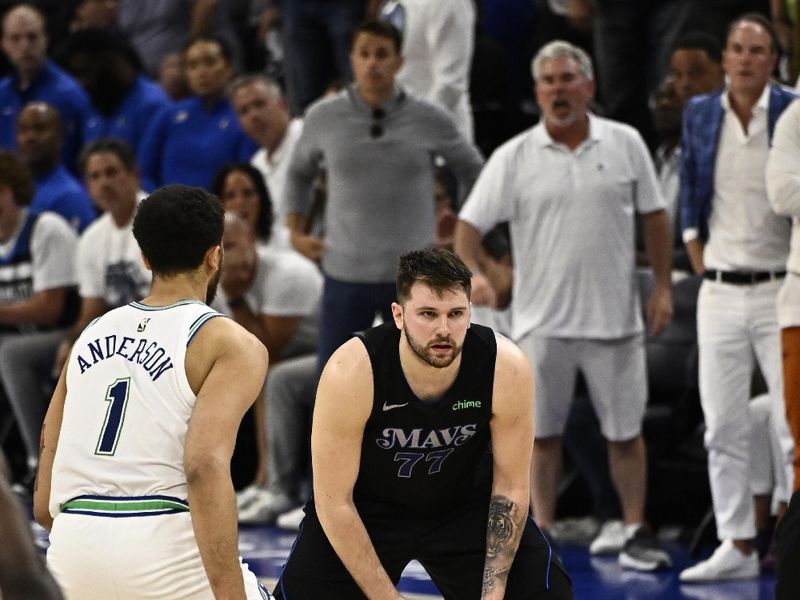 MINNEAPOLIS, MN -  MAY 24:  Luka Doncic #77 of the Dallas Mavericks handles the ball during the game against the Minnesota Timberwolves during Round 3 Game 2 of the 2024 NBA Playoffs on May 24, 2024 at Target Center in Minneapolis, Minnesota. NOTE TO USER: User expressly acknowledges and agrees that, by downloading and or using this Photograph, user is consenting to the terms and conditions of the Getty Images License Agreement. Mandatory Copyright Notice: Copyright 2024 NBAE (Photo by David Dow/NBAE via Getty Images)