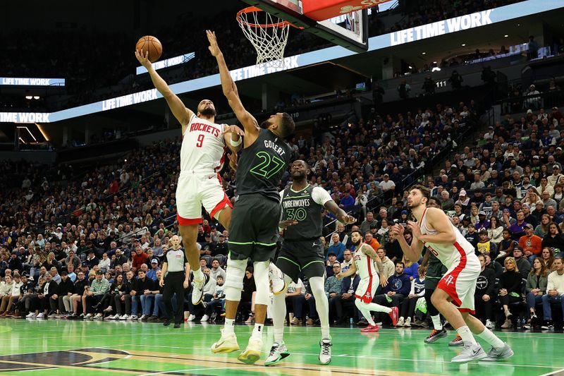 MINNEAPOLIS, MINNESOTA - NOVEMBER 26: Dillon Brooks #9 of the Houston Rockets goes up for a shot against Rudy Gobert #27 of the Minnesota Timberwolves in the fourth quarter during the Emirates NBA Cup at Target Center on November 26, 2024 in Minneapolis, Minnesota. The Rockets defeated the Timberwolves 117-111 in overtime. NOTE TO USER: User expressly acknowledges and agrees that, by downloading and or using this photograph, User is consenting to the terms and conditions of the Getty Images License Agreement. (Photo by David Berding/Getty Images)