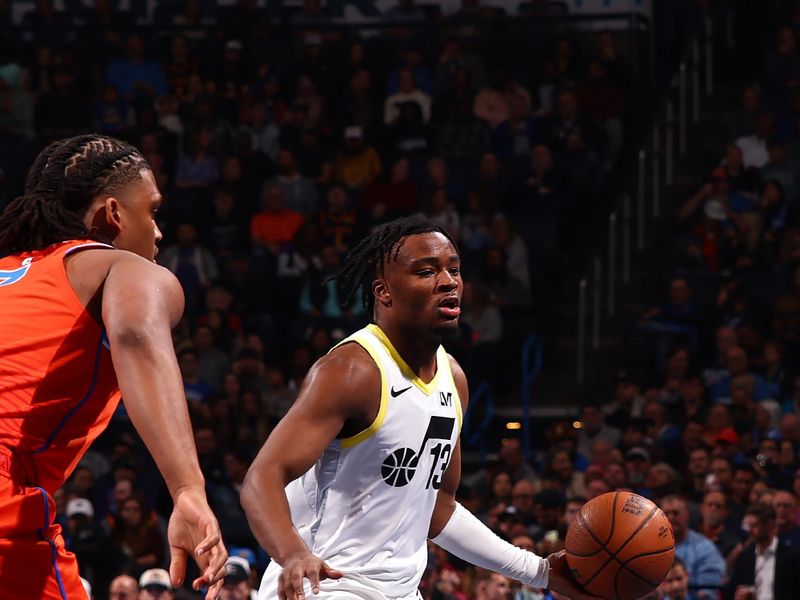 OKLAHOMA CITY, OK - DECEMBER 3: Isaiah Collier #13 of the Utah Jazz dribbles the ball during the game against the Oklahoma City Thunder during the Emirates NBA Cup game on on December 3, 2024 at Paycom Center in Oklahoma City, Oklahoma. NOTE TO USER: User expressly acknowledges and agrees that, by downloading and or using this photograph, User is consenting to the terms and conditions of the Getty Images License Agreement. Mandatory Copyright Notice: Copyright 2024 NBAE (Photo by Zach Beeker/NBAE via Getty Images)