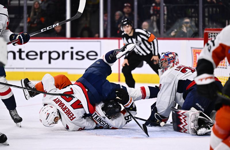 Dec 14, 2023; Philadelphia, Pennsylvania, USA; Washington Capitals defenseman Martin Fehervary (42) collides with Philadelphia Flyers right wing Cam Atkinson (89) in the third period at Wells Fargo Center. Mandatory Credit: Kyle Ross-USA TODAY Sports