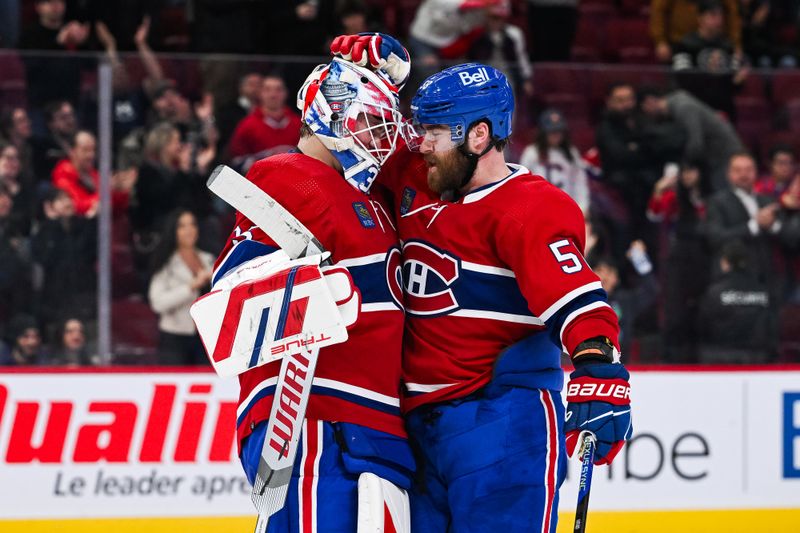 Feb 27, 2024; Montreal, Quebec, CAN; Montreal Canadiens goalie Sam Montembeault (35) celebrates the win with defenseman David Savard (58) after the end of the game against the Arizona Coyotes at Bell Centre. Mandatory Credit: David Kirouac-USA TODAY Sports