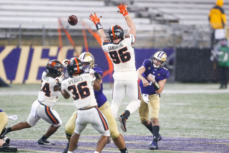 Nov 14, 2020; Seattle, Washington, USA; Washington Huskies quarterback Dylan Morris (9) throws against the Oregon State Beavers during the first quarter at Alaska Airlines Field at Husky Stadium. Mandatory Credit: Joe Nicholson-USA TODAY Sports