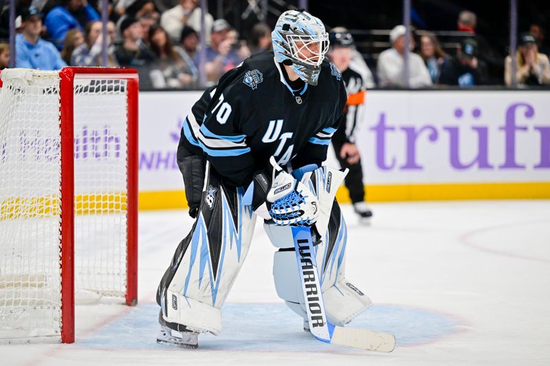 Nov 29, 2024; Salt Lake City, Utah, USA; Utah Hockey Club goaltender Karel Vejmelka (70) in the goal against the Edmonton Oilers during the third period at the Delta Center. Mandatory Credit: Christopher Creveling-Imagn Images