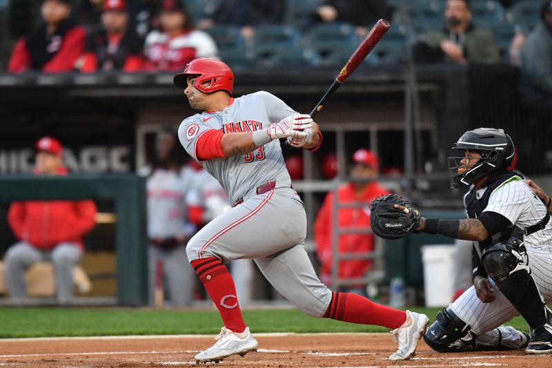 Apr 12, 2024; Chicago, Illinois, USA; Cincinnati Reds first base Christian Encarnacion-Strand (33) hits a sacrifice RBI during the first inning against the Chicago White Sox at Guaranteed Rate Field. Mandatory Credit: Patrick Gorski-USA TODAY Sports