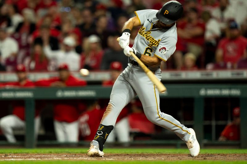 Sep 23, 2023; Cincinnati, Ohio, USA; Pittsburgh Pirates first baseman Alfonso Rivas (6) hits an RBI single in the eighth inning against the Cincinnati Reds at Great American Ball Park. Mandatory Credit: The Cincinnati Enquirer-USA TODAY Sports