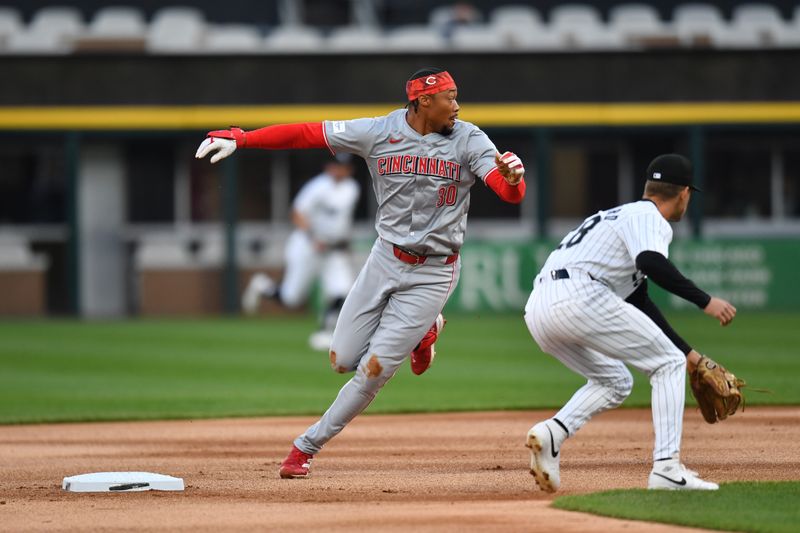 Apr 12, 2024; Chicago, Illinois, USA; Cincinnati Reds center fielder Will Benson (30) rounds second base after hitting a double during the first inning against the Chicago White Sox at Guaranteed Rate Field. Mandatory Credit: Patrick Gorski-USA TODAY Sports
