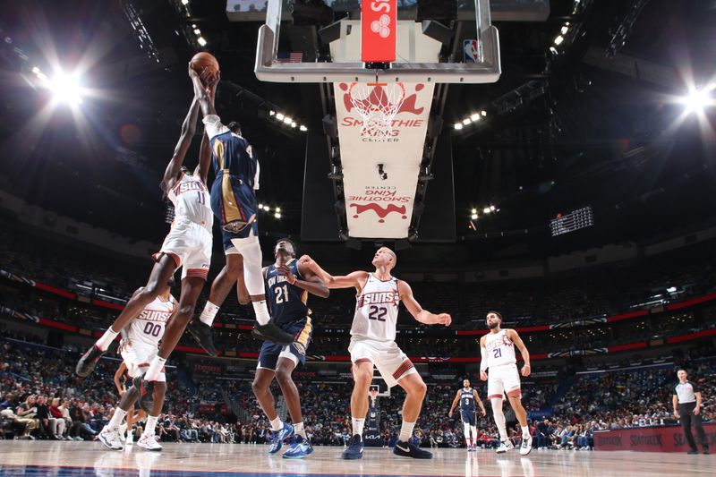 NEW ORLEANS, LA - DECEMBER 5: Bol Bol #11 of the Phoenix Suns and Javonte Green #4 of the New Orleans Pelicans grabs the rebound during the game on December 5, 2024 at the Smoothie King Center in New Orleans, Louisiana. NOTE TO USER: User expressly acknowledges and agrees that, by downloading and or using this Photograph, user is consenting to the terms and conditions of the Getty Images License Agreement. Mandatory Copyright Notice: Copyright 2024 NBAE (Photo by Layne Murdoch Jr./NBAE via Getty Images)