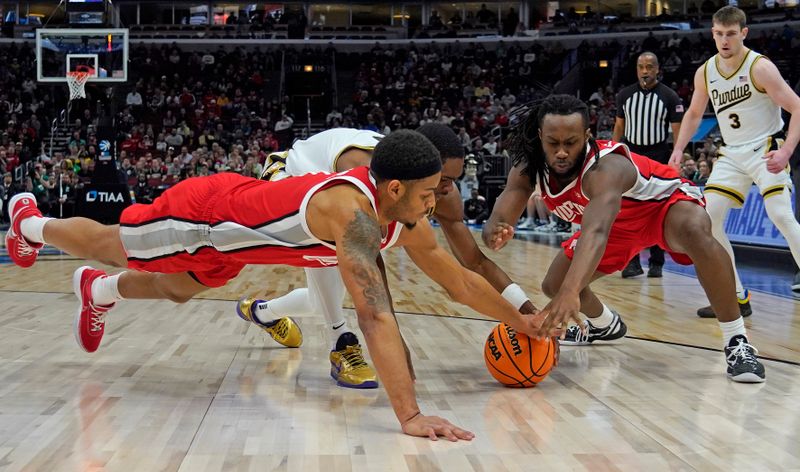 Mar 11, 2023; Chicago, IL, USA; Ohio State Buckeyes guards Roddy Gayle Jr. (left) and Bruce Thornton (right) battle for the ball with Purdue Boilermakers guard Brandon Newman (center) during the first half at United Center. Mandatory Credit: David Banks-USA TODAY Sports