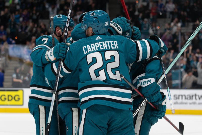 Jan 23, 2024; San Jose, California, USA; San Jose Sharks center Ryan Carpenter (22) hugs his teammates after defeating the New York Rangers in overtime at SAP Center at San Jose. Mandatory Credit: Stan Szeto-USA TODAY Sports