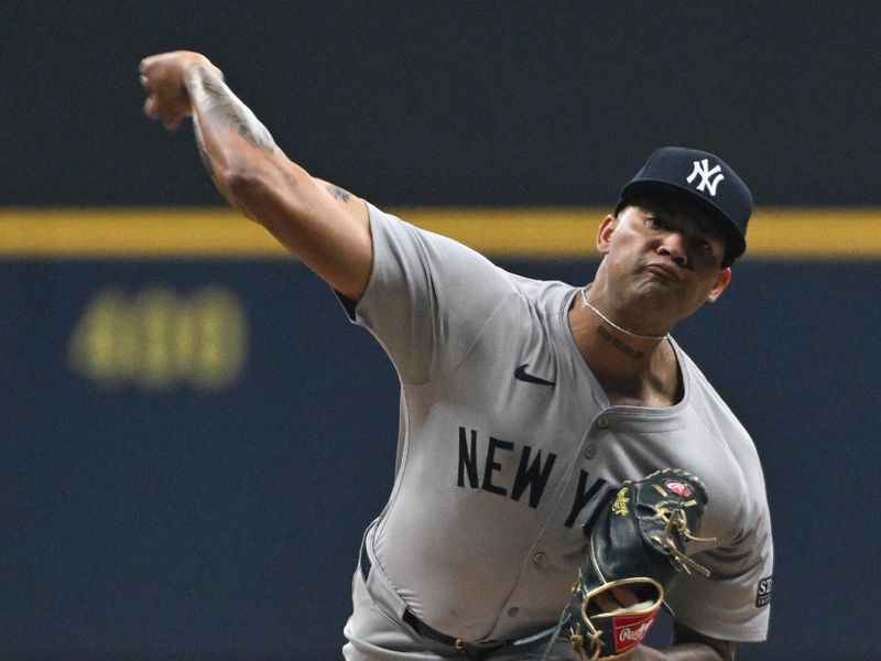 Apr 26, 2024; Milwaukee, Wisconsin, USA; New York Yankees pitcher Luis Gil (81) delivers a pitch against the Milwaukee Brewers in the first inning at American Family Field. Mandatory Credit: Michael McLoone-USA TODAY Sports