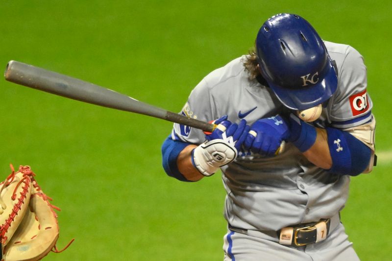 Aug 27, 2024; Cleveland, Ohio, USA; Kansas City Royals shortstop Bobby Witt Jr. (7) is hit by a pitch in the seventh inning against the Cleveland Guardians at Progressive Field. Mandatory Credit: David Richard-USA TODAY Sports