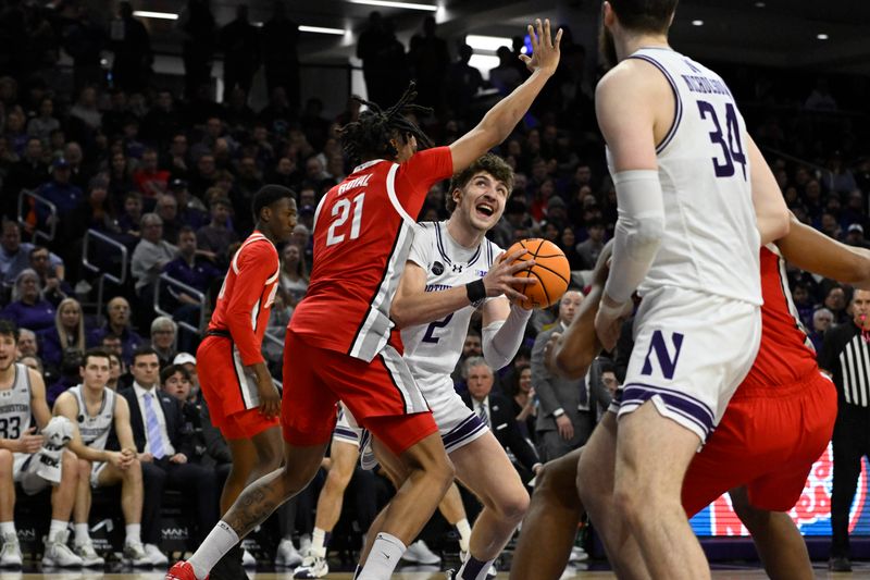 Jan 27, 2024; Evanston, Illinois, USA; Northwestern Wildcats forward Nick Martinelli (2) drives to the basket against Ohio State Buckeyes forward Devin Royal (21) during the second half  at Welsh-Ryan Arena. Mandatory Credit: Matt Marton-USA TODAY Sports