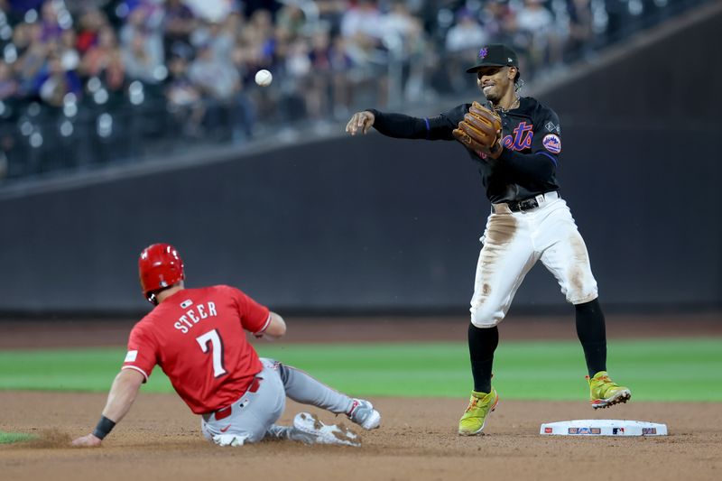 Sep 6, 2024; New York City, New York, USA; New York Mets shortstop Francisco Lindor (12) forces out Cincinnati Reds left fielder Spencer Steer (7) and second and throws to first to complete a double play on a ball hit by Reds center fielder TJ Friedl (29) during the second inning at Citi Field. Mandatory Credit: Brad Penner-Imagn Images