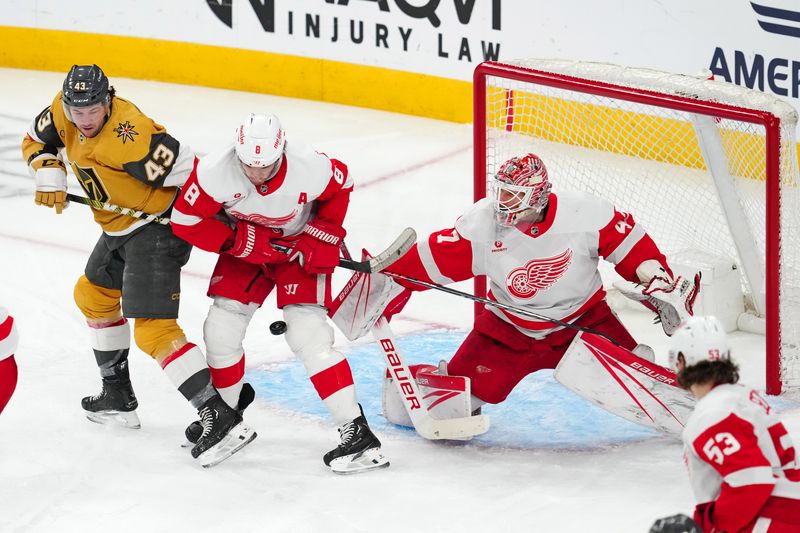 Mar 9, 2024; Las Vegas, Nevada, USA; An incoming shot deflects off the leg of Detroit Red Wings defenseman Ben Chiarot (8) as Vegas Golden Knights center Paul Cotter (43) looks for a deflection in front of Detroit Red Wings goaltender James Reimer (47) during the third period at T-Mobile Arena. Mandatory Credit: Stephen R. Sylvanie-USA TODAY Sports